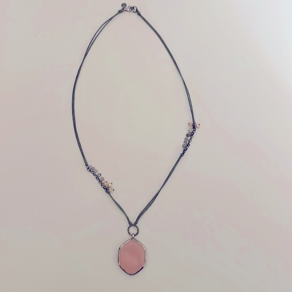 Silpada Pink Soapstone, Quartz, Pearl and Sterling Silver on a gray cord.